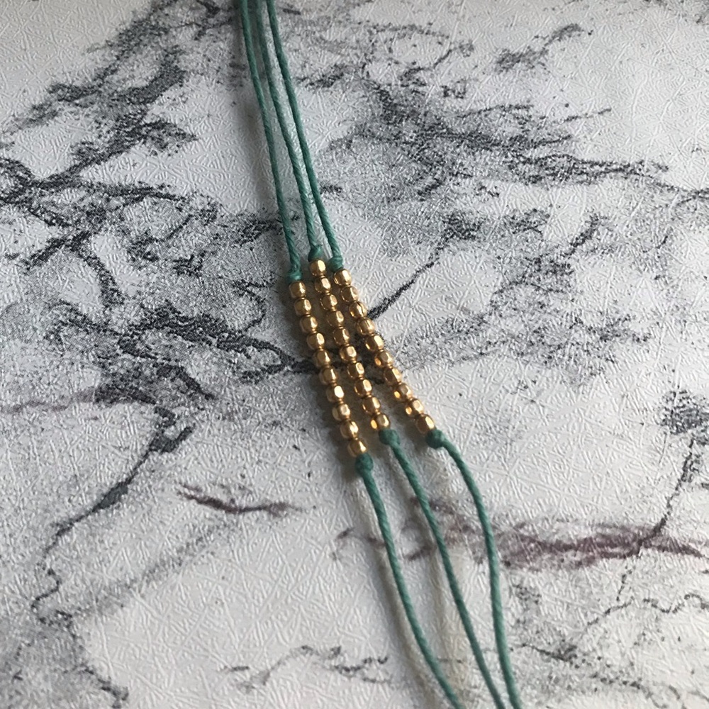 3- strand blue silk and gold bracelet